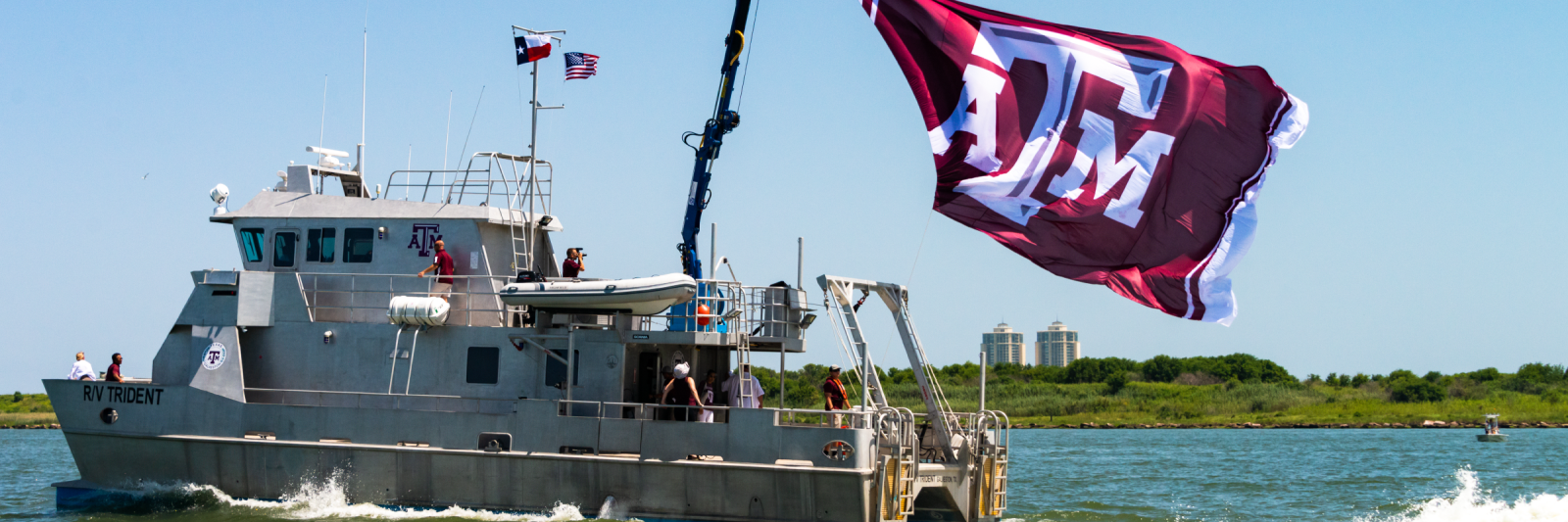 Image of research vessel with ATM flag